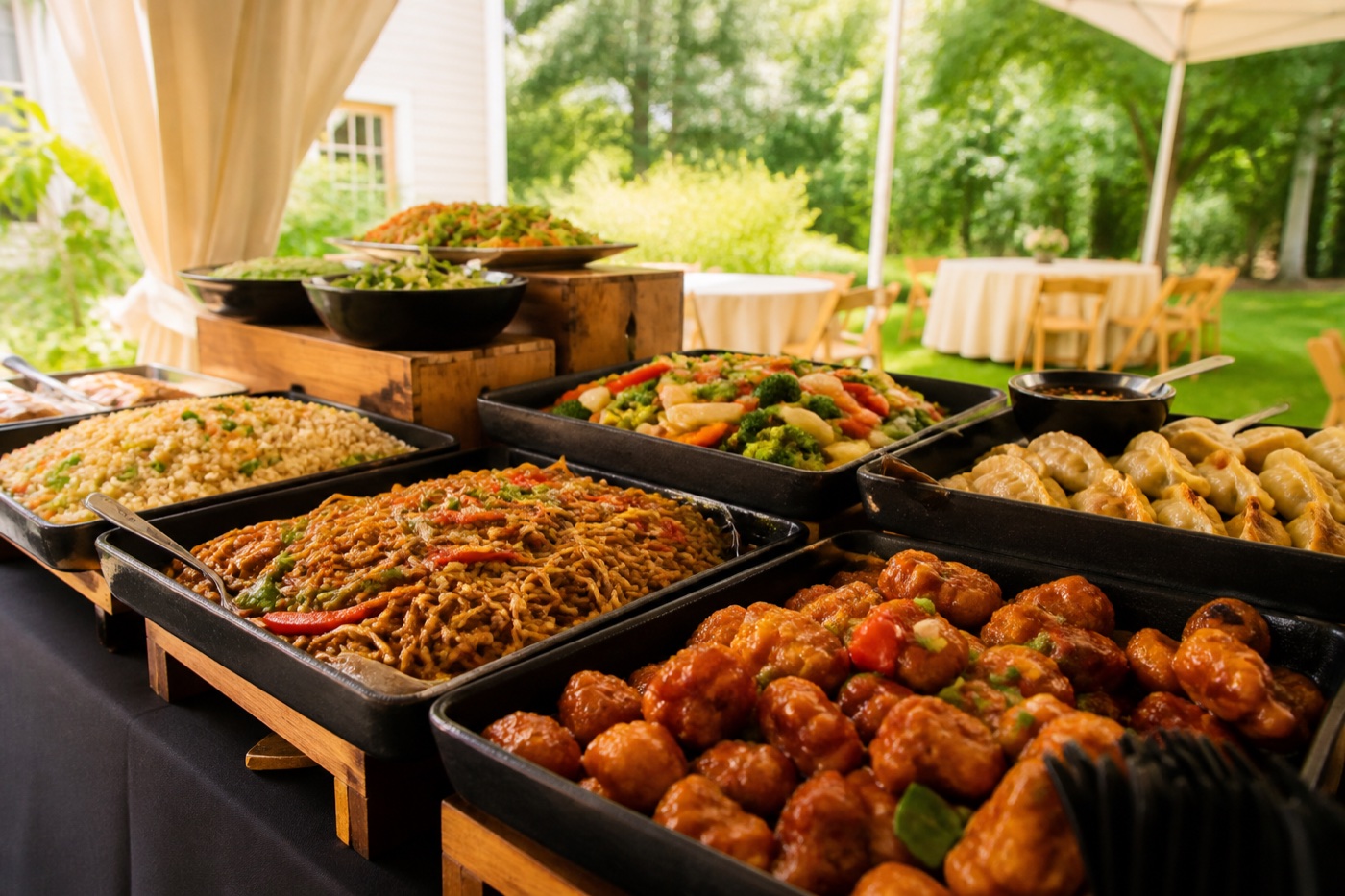 Asian fusion buffet set up at an outdoor catered event